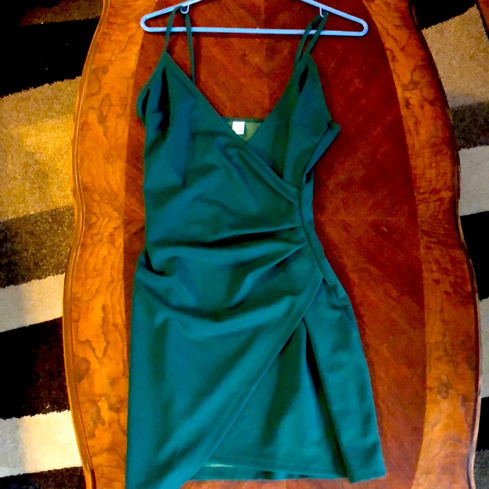 Medium body con dress with ruched side and asymmetrical hem